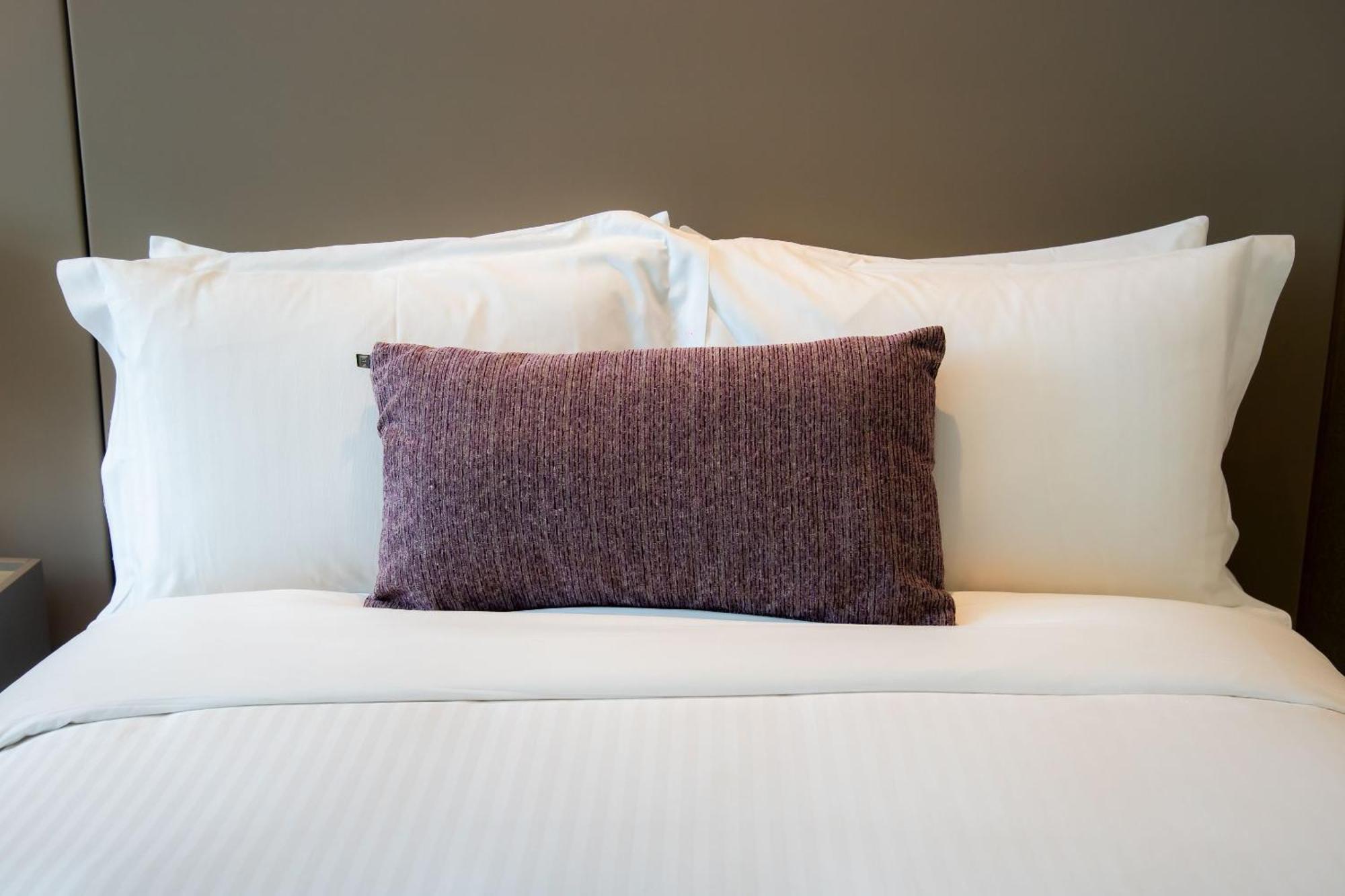 Camino Real Fashion Drive Monterrey Hotel San Pedro Garza Garcia Luaran gambar A bed with pillows